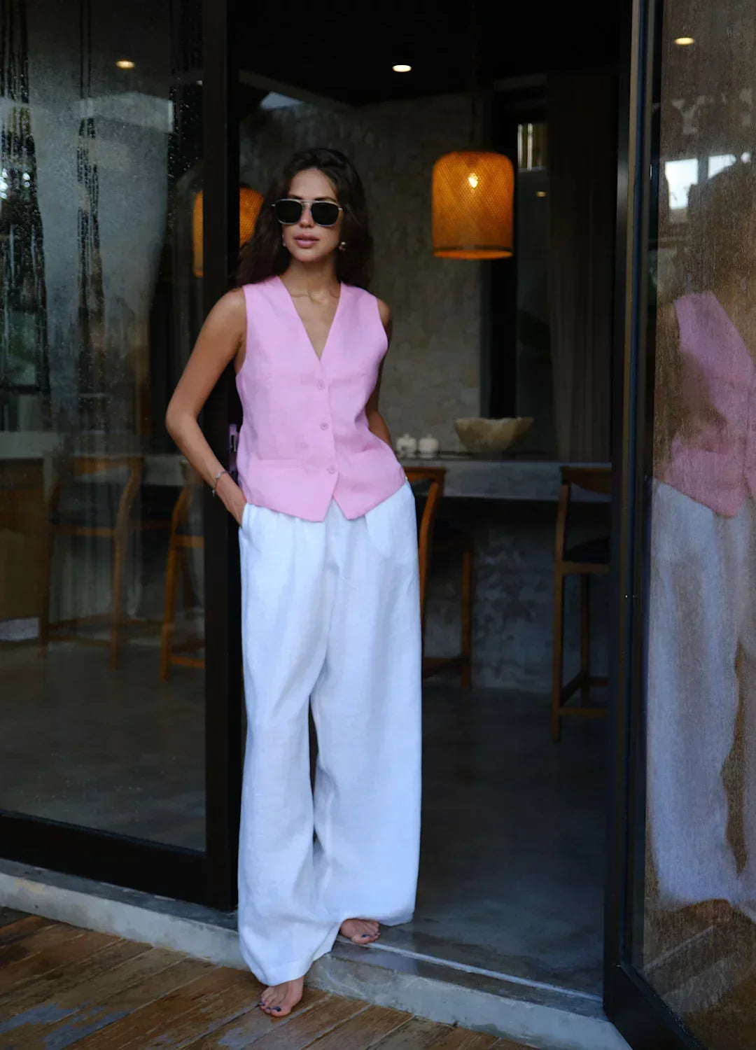 Light beige women's high-waist wide-leg linen blend pants with a loose pull-on design, perfect for casual or summer wear.