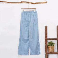 Light beige cotton linen wide-leg women's drawstring trousers with a relaxed fit and pull-on design, perfect for casual wear.