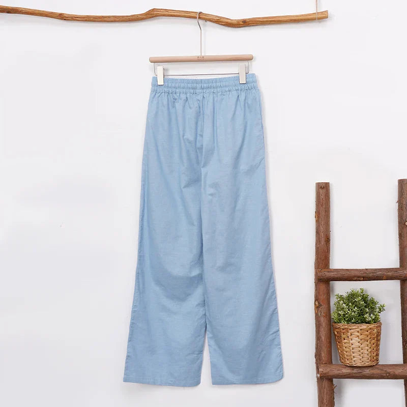 Light beige cotton linen wide-leg women's drawstring trousers with a relaxed fit and pull-on design, perfect for casual wear.