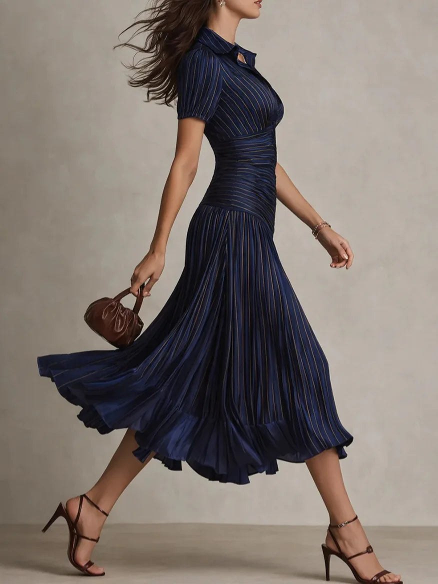 White pleated midi dress for women by Tammy Bradley, featuring a flowing design and elegant pleats.