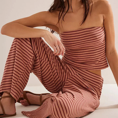 Light beige women's knit wide-leg trousers with a loose pull-on style, featuring a relaxed fit and soft fabric.
