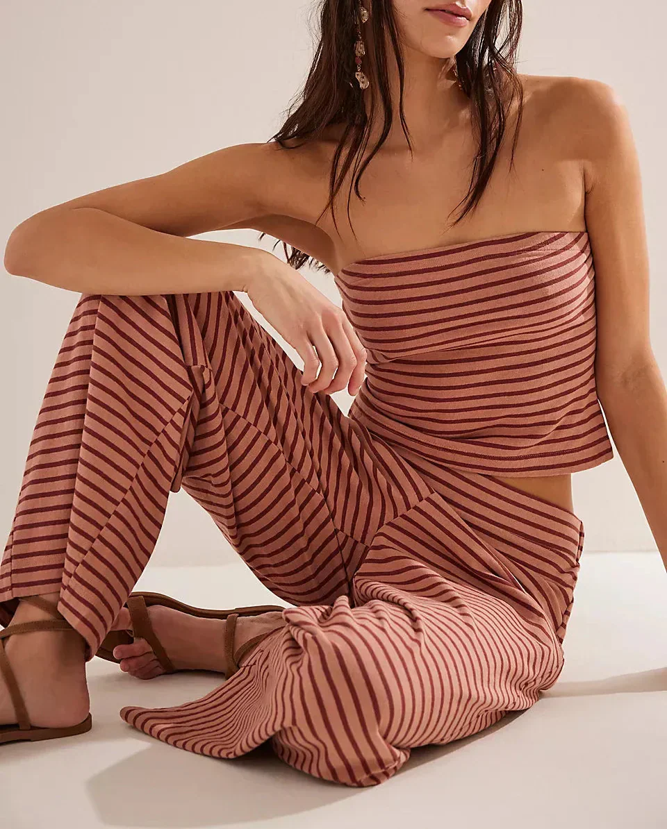 Light beige women's knit wide-leg trousers with a loose pull-on style, featuring a relaxed fit and soft fabric.