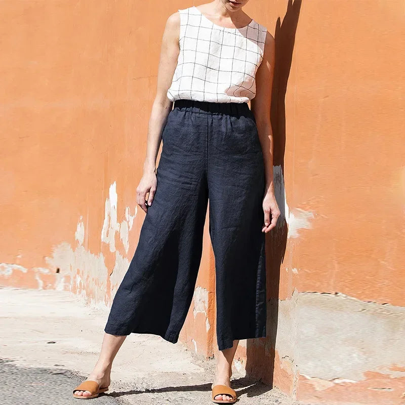 Light beige linen cropped wide-leg drawstring trousers for women, loose pull-on style with relaxed fit and comfortable waistband.