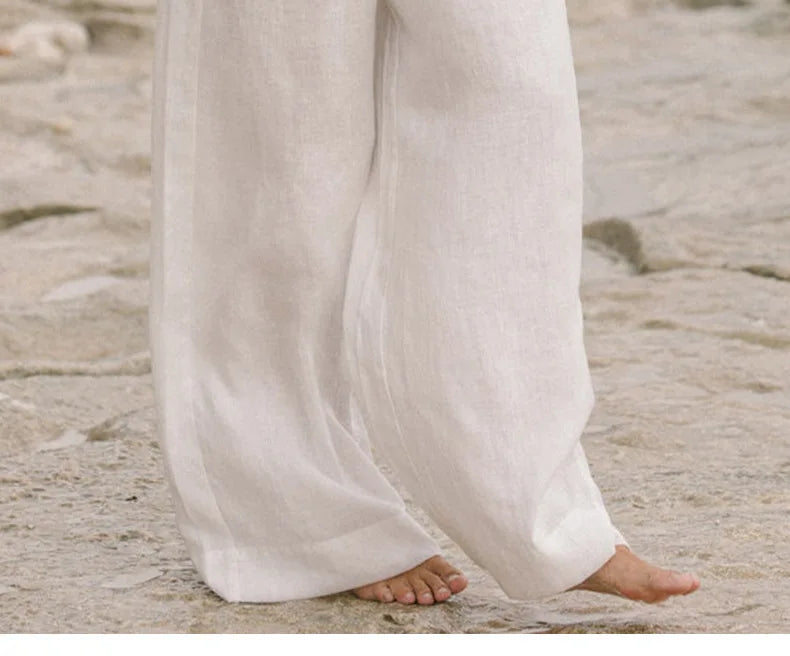 Light beige linen wide-leg trousers for women with a loose pull-on style, featuring a relaxed fit and comfortable waistband.