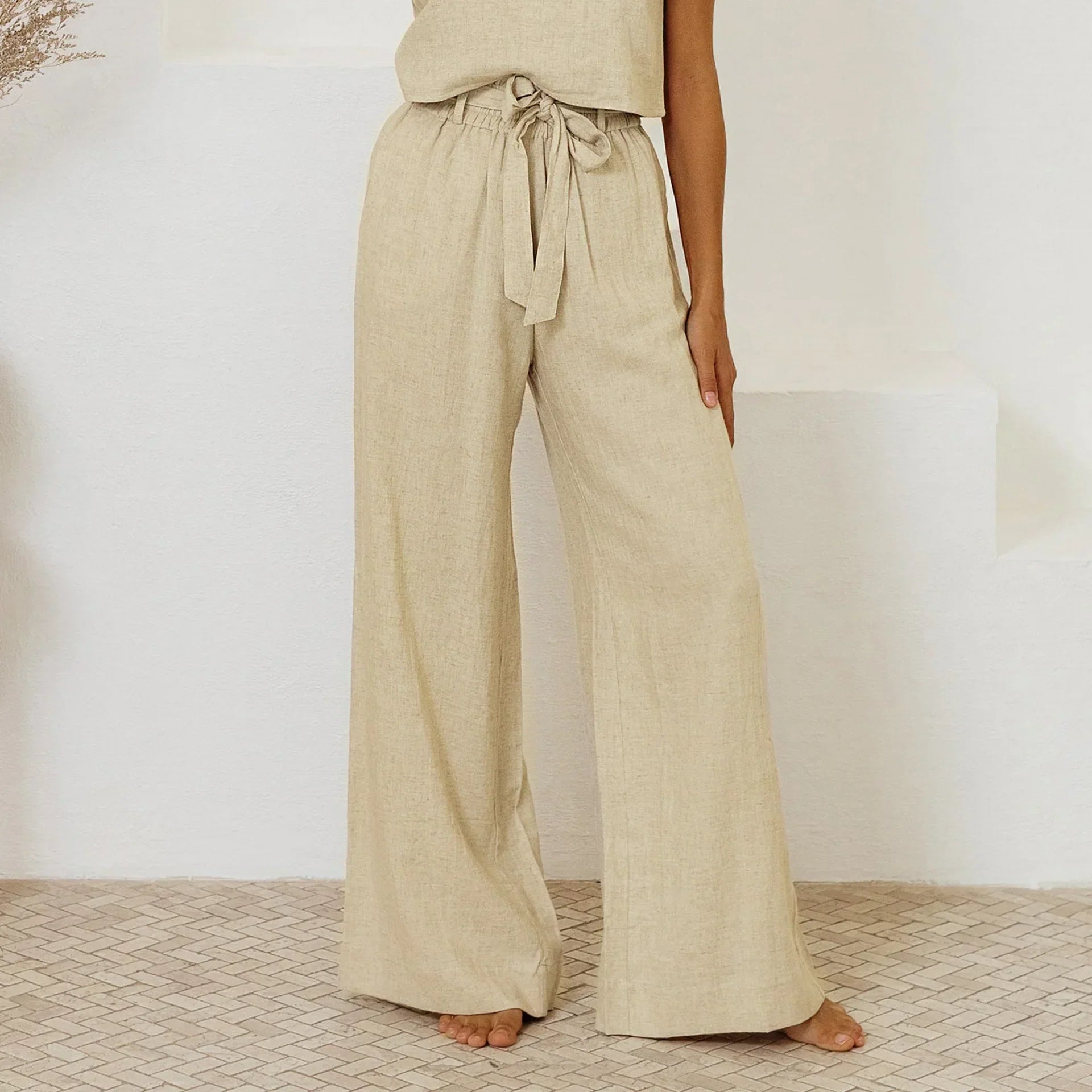Linen wide-leg trousers for women, loose pull-on pants in natural beige, featuring a relaxed fit and casual style.