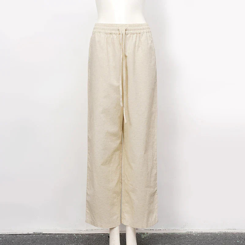 Light beige cotton linen wide-leg drawstring trousers for women, loose pull-on pants with a relaxed fit and comfortable waistband.
