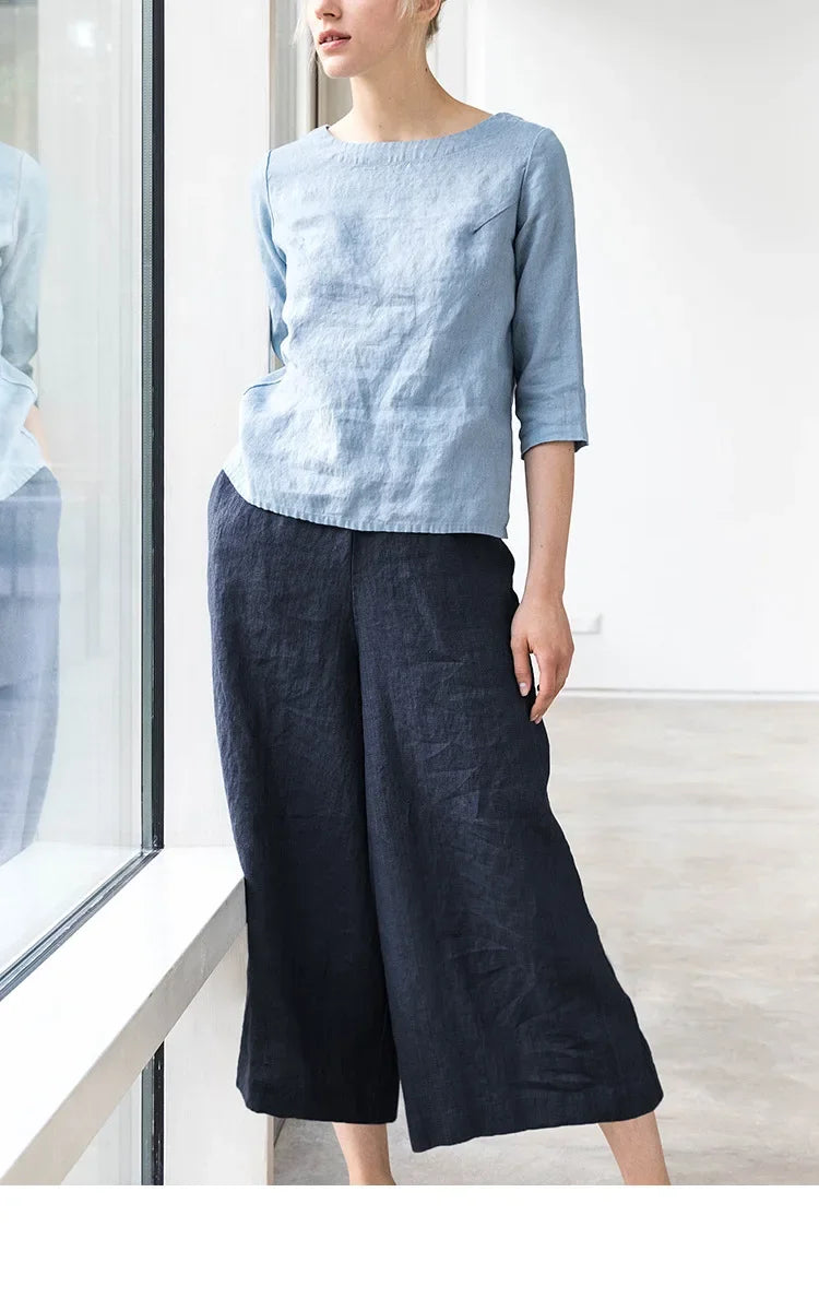 Linen cropped wide-leg drawstring trousers for women, loose pull-on style with relaxed fit, in neutral linen fabric.
