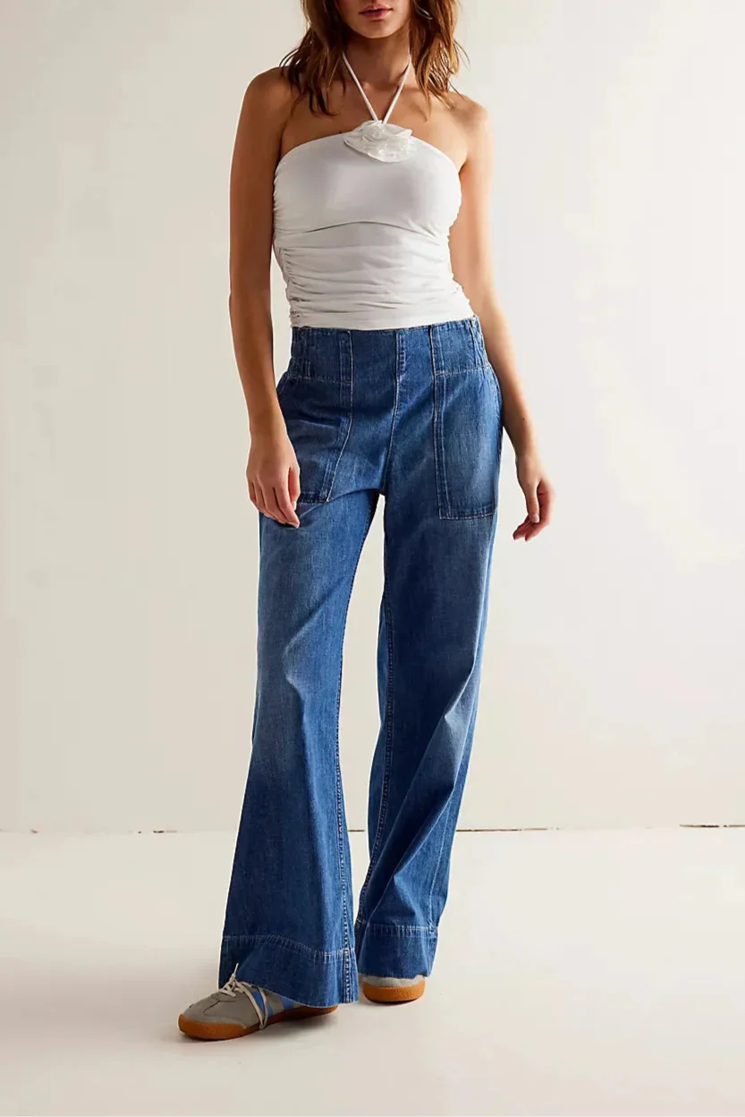 Blue denim wide-leg women's jeans with relaxed fit, featuring a high waist and classic five-pocket design.