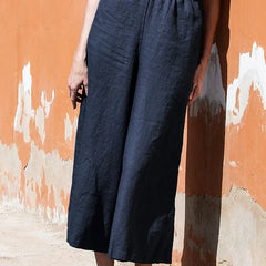 Linen cropped wide-leg drawstring trousers for women, loose pull-on pants, featuring a relaxed fit and lightweight fabric.