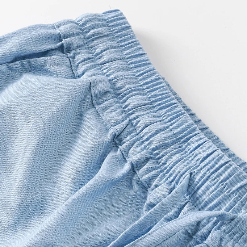 Women’s cotton linen wide leg drawstring trousers in a loose pull-on style, featuring comfortable and breathable fabric.