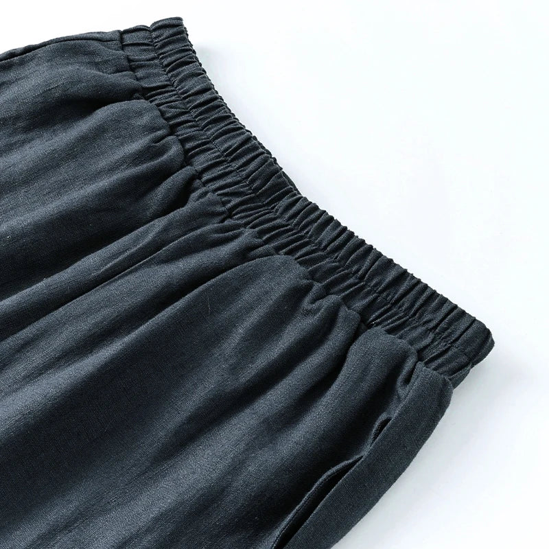 Linen cropped wide-leg drawstring trousers for women, loose pull-on style, in a light and breathable fabric.