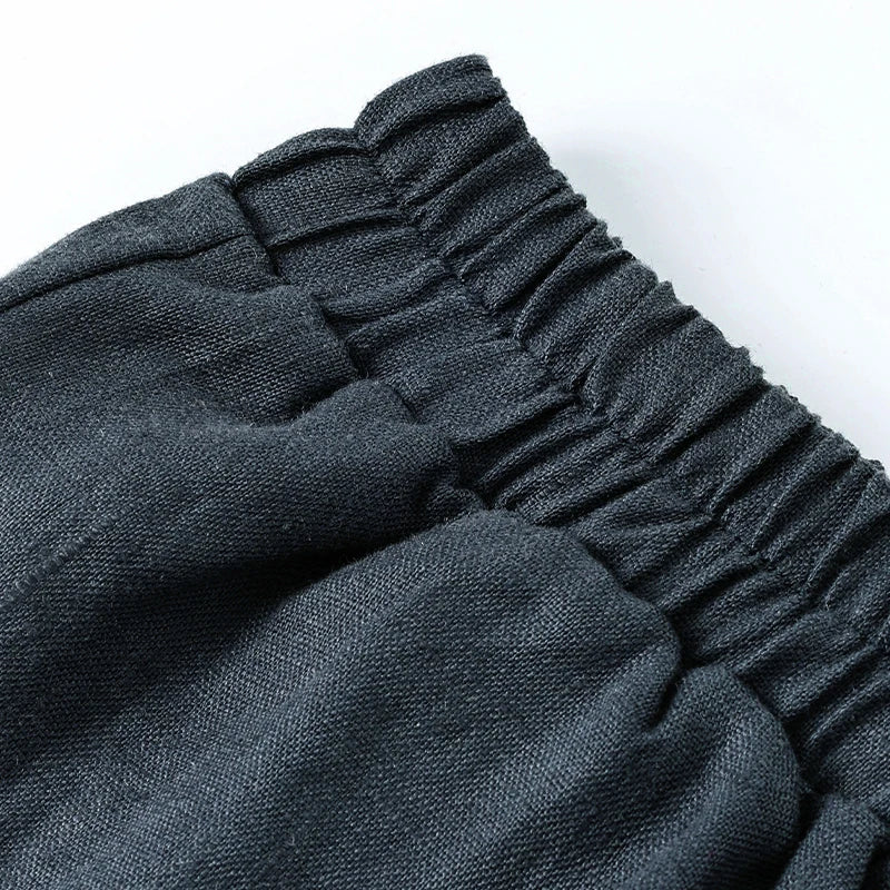 Linen cropped wide-leg drawstring trousers for women with a loose fit and pull-on design, featuring a relaxed, breathable style.