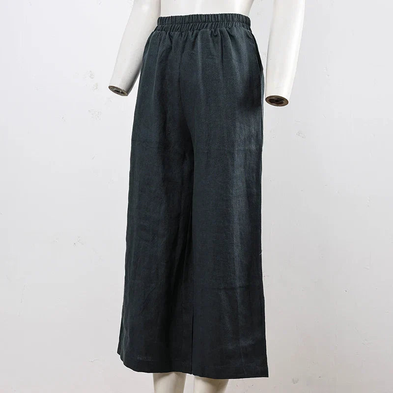 Linen cropped wide-leg drawstring trousers for women, loose pull-on style, in soft fabric with relaxed fit and casual design.