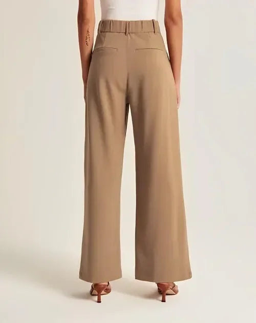White wide-leg high-waist trousers for women, stylish high-waist pants with a relaxed fit and tailored design.