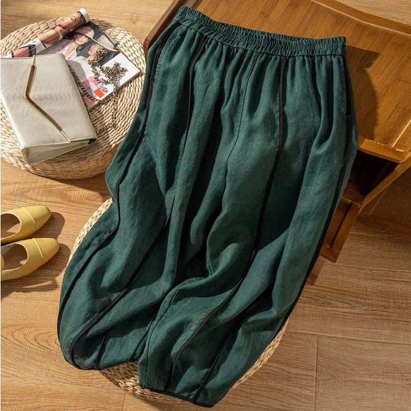 Linen wide-leg elastic-waist trousers for women, loose pull-on pants with relaxed fit and natural fabric texture.