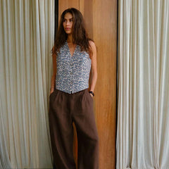 Women’s high-waist wide-leg linen blend trousers with a loose pull-on design, shown in a neutral color on a model.