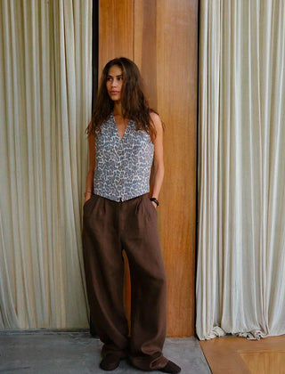 Women’s high-waist wide-leg linen blend trousers with a loose pull-on design, shown in a neutral color on a model.