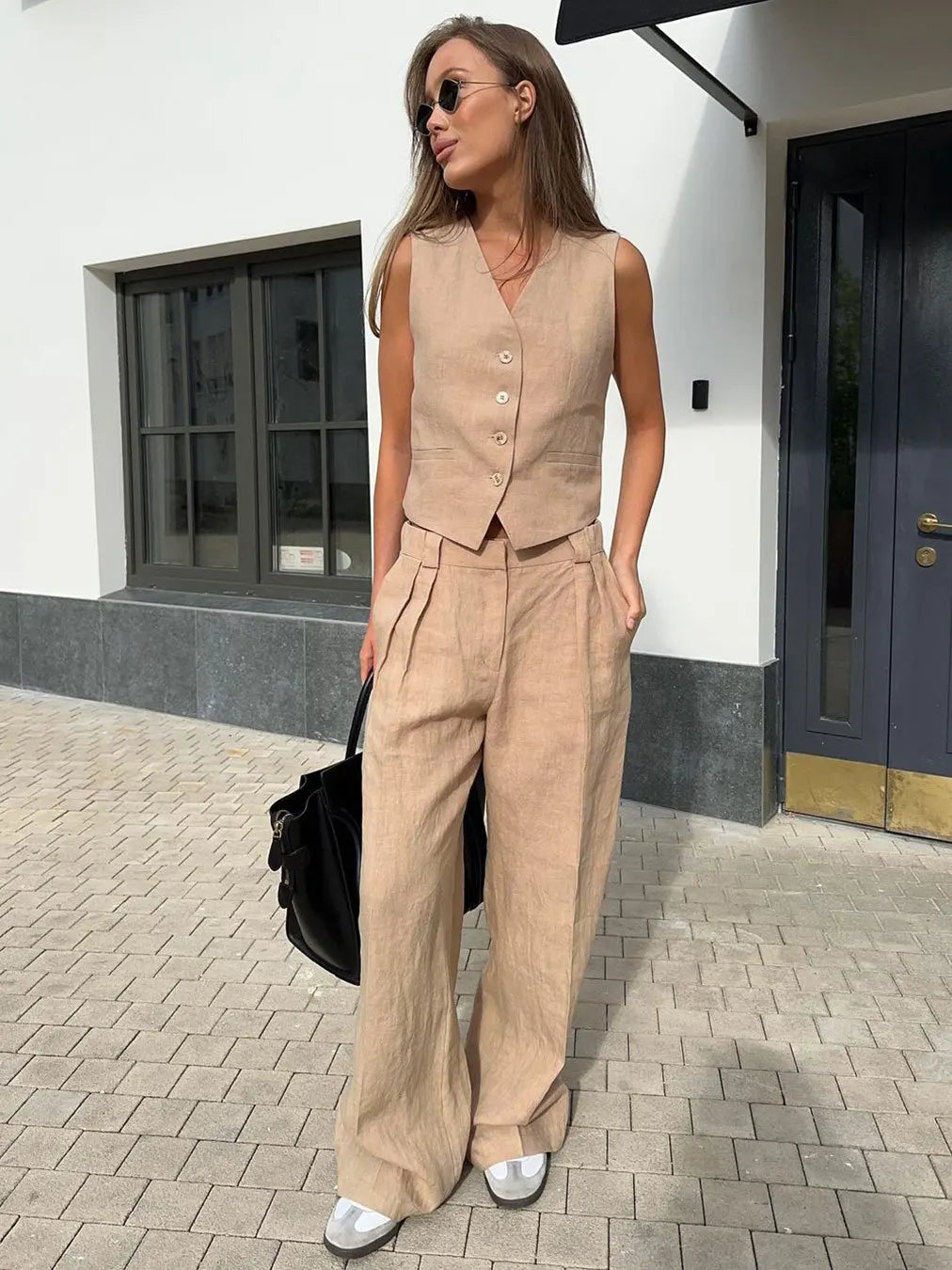 Women's white wide leg linen trousers with high waist, stylish and comfortable pants for casual or summer wear.