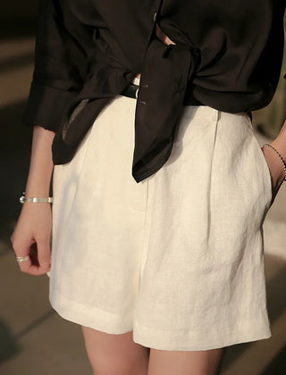 High-waist pleated linen shorts for women, tailored office pants with a relaxed fit and stylish design.