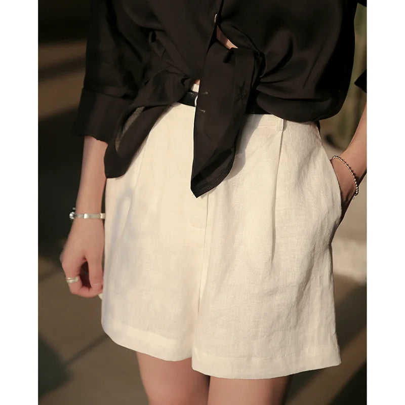 High-waist pleated linen shorts for women, tailored office pants with a relaxed fit and stylish design.