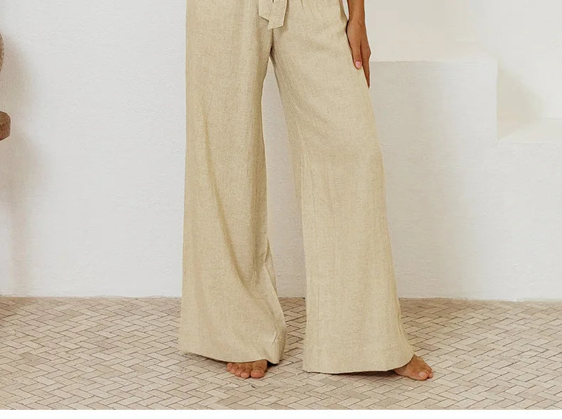 Linen wide-leg pull-on trousers for women, loose fit, natural beige color, styled casually with a relaxed fit and high waist.