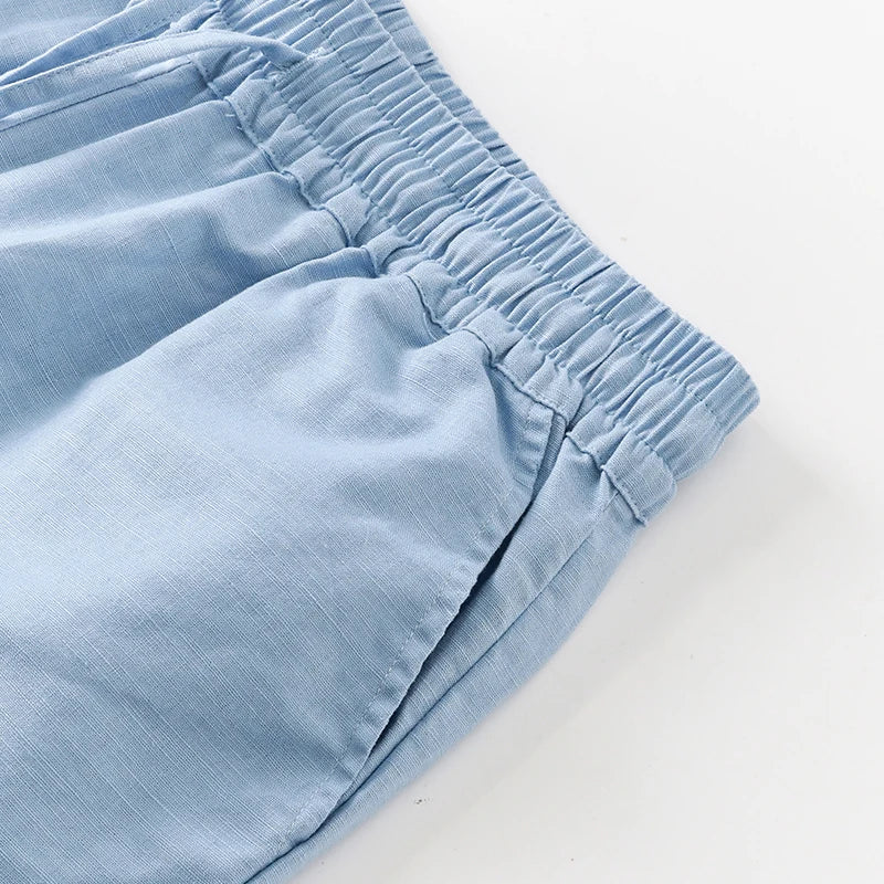 Women's cotton linen wide-leg drawstring trousers with a loose fit and pull-on design, shown in a casual, comfortable style.
