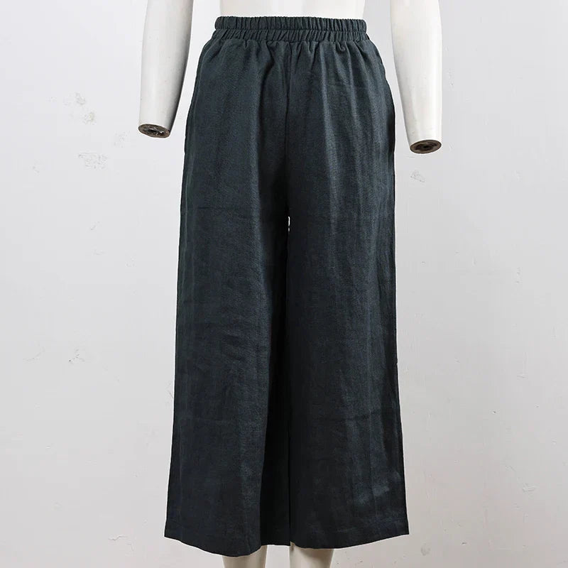 Light beige linen cropped wide-leg drawstring pants for women, featuring a relaxed fit and pull-on style.