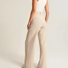 White wide-leg high-waist trousers for women, stylish high waist pants with a relaxed fit and modern design.