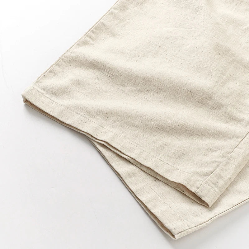 Light beige cotton linen wide-leg women's trousers with drawstring waist and loose fit, pull-on style, casual and comfortable.