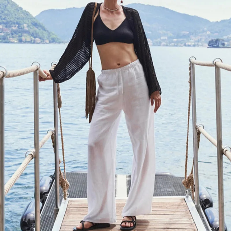 Knit wide-leg women's drawstring trousers in a loose, pull-on style, featuring a comfortable fit and casual design.