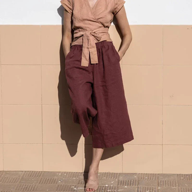 Linen cropped wide-leg drawstring trousers for women with a loose fit and pull-on style, featuring a relaxed, comfortable design.