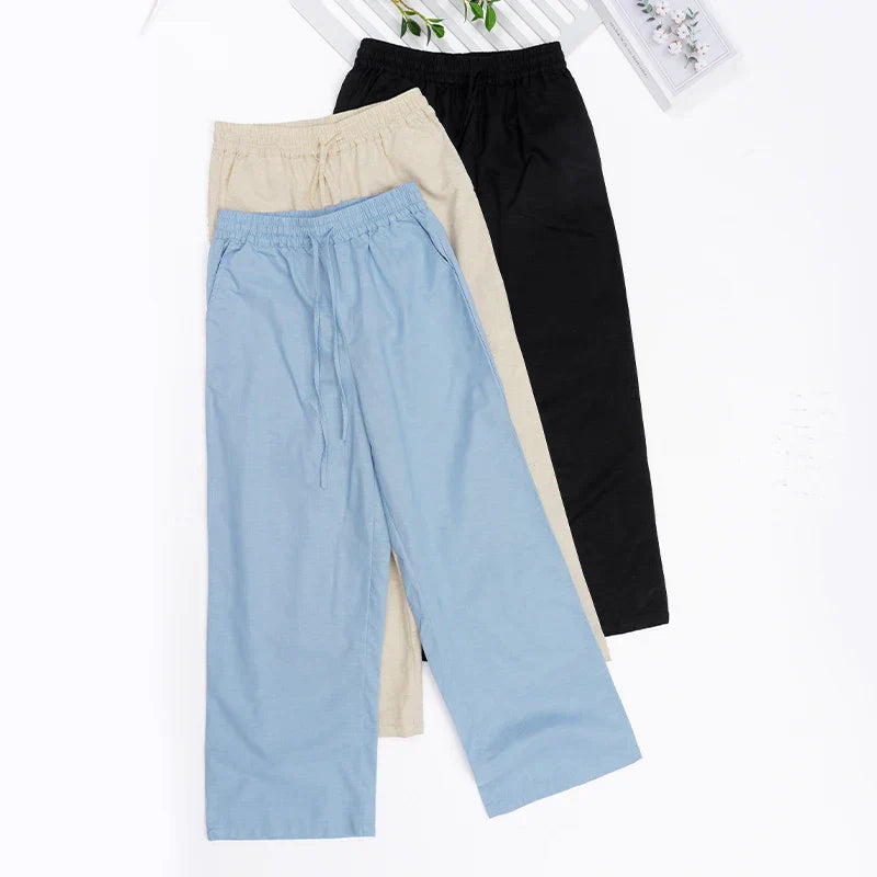 Women’s cotton linen wide-leg drawstring trousers with a loose fit and pull-on style, ideal for casual and comfortable wear.