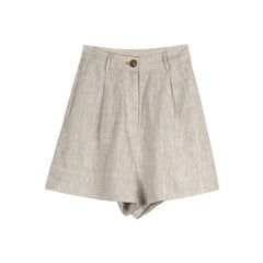 High-waist pleated linen shorts for women, tailored office pants with a relaxed fit and elegant design, in natural linen fabric.