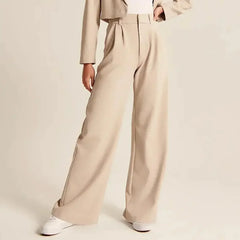 White wide-leg high-waist women's trousers with a relaxed fit and tailored design, perfect for modern, stylish outfits.