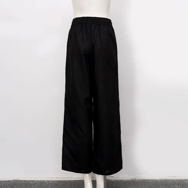 Light beige women's cotton linen wide-leg drawstring trousers with a relaxed fit and pull-on design, perfect for casual wear.