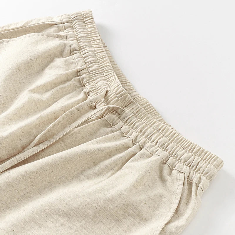 Women’s cotton linen wide-leg drawstring trousers with a loose fit and pull-on design, perfect for casual and comfortable style.