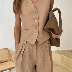 Women's white high-waist wide leg linen trousers, stylish and comfortable pants for women, shown in natural fabric detail.