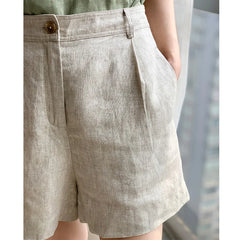 High-waist pleated linen shorts for women featuring a tailored fit, perfect for office or casual wear.