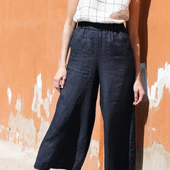 Linen cropped wide-leg drawstring trousers for women, loose pull-on pants in a relaxed fit, shown in neutral color.