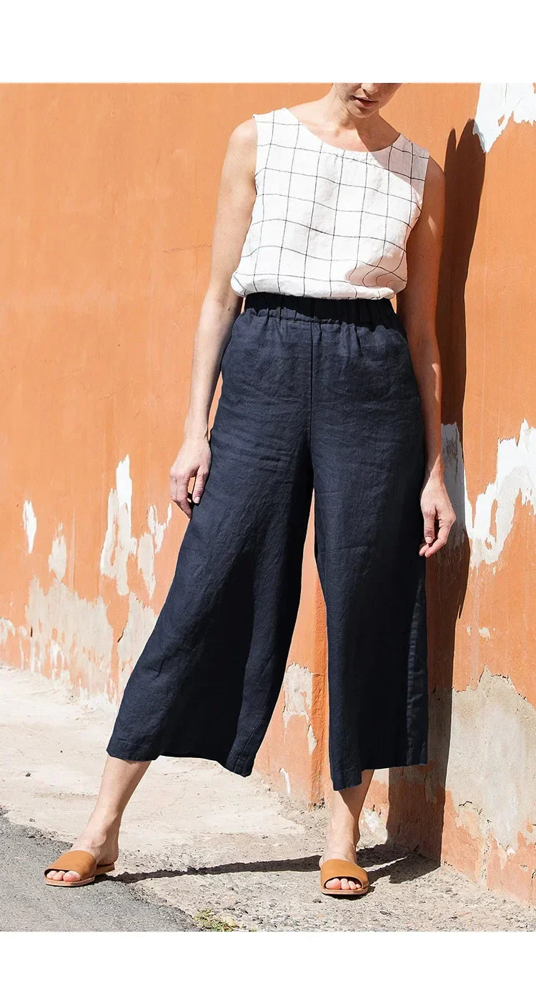 Linen cropped wide-leg drawstring trousers for women, loose pull-on pants in a relaxed fit, shown in neutral color.