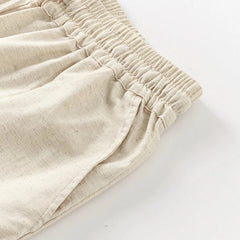 Light beige cotton linen wide-leg drawstring trousers for women, loose pull-on style with relaxed fit and comfortable waistband.