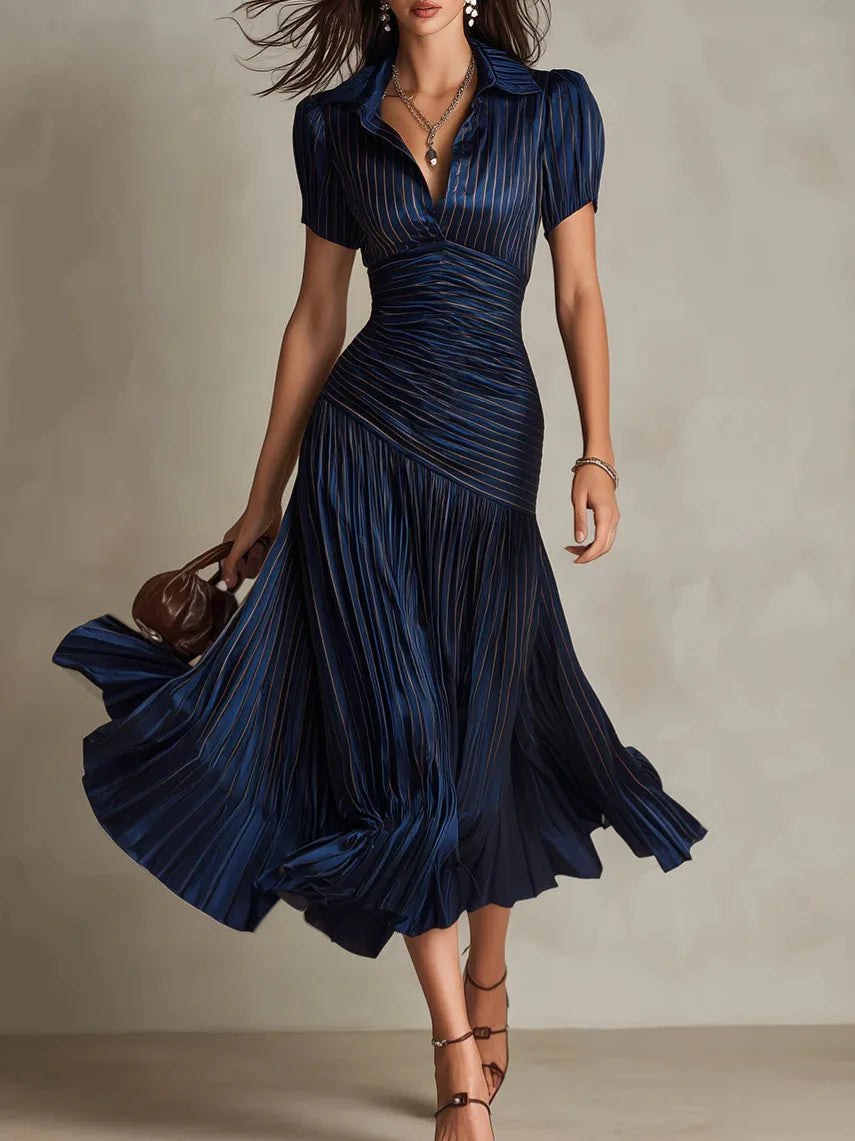 White pleated midi dress for women by Tammy Bradley, featuring a flowing design with elegant pleats and a midi length.