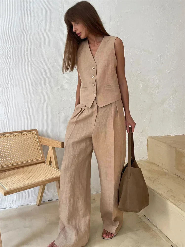 Women's white wide leg linen trousers with high waist, stylish and comfortable pants for casual or office wear.