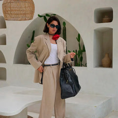 Women's high-waist wide-leg linen blend trousers, loose pull-on pants, in a relaxed fit, shown on a model.