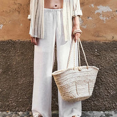 Knit wide-leg drawstring trousers for women featuring a loose fit, pull-on style, and casual comfort.