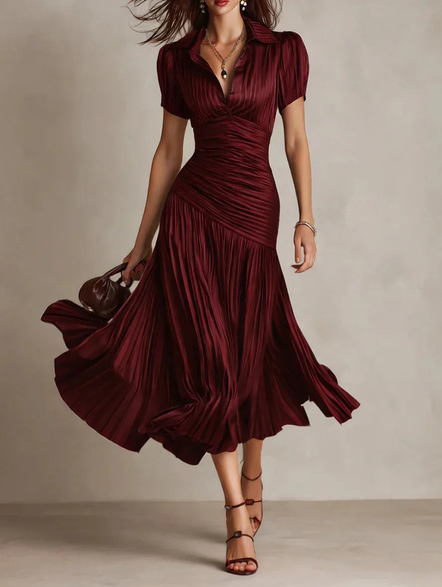 White pleated midi dress for women by Tammy Bradley, showcasing a stylish and elegant design with a flowing pleated skirt.