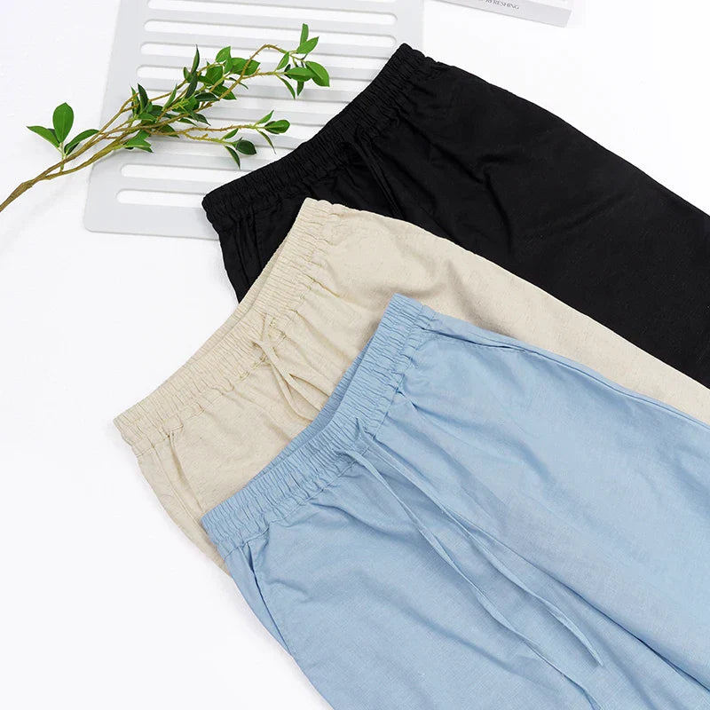 Women’s cotton linen wide-leg drawstring trousers with loose fit and pull-on design, perfect for casual and comfortable styling.
