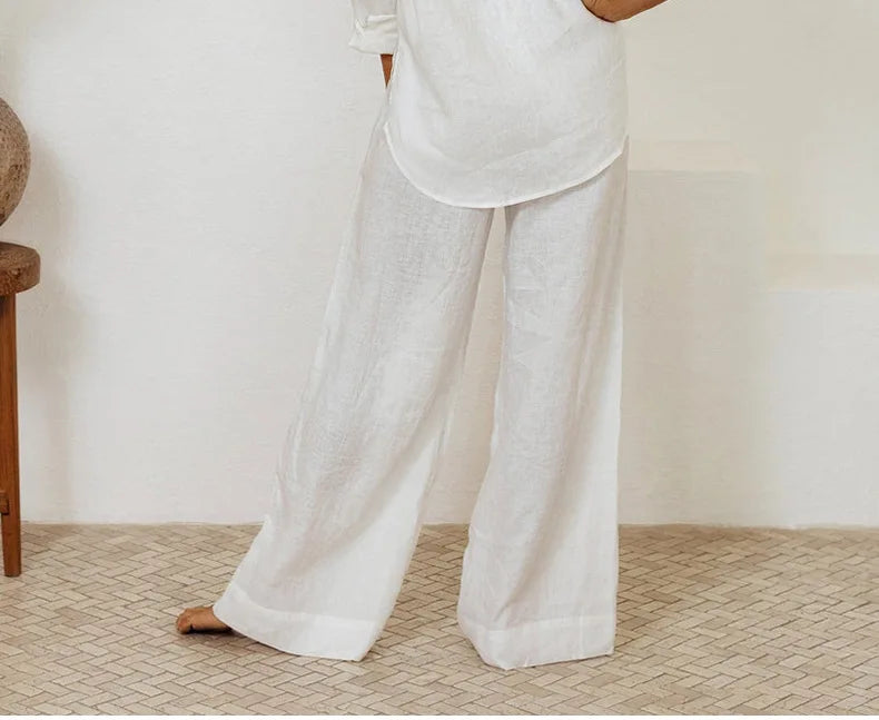 Light beige linen wide-leg trousers for women featuring a loose pull-on design, casual and comfortable for everyday wear.