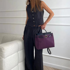 Women's white high-waist linen wide-leg trousers with relaxed fit and tailored design, perfect for casual or chic outfits.