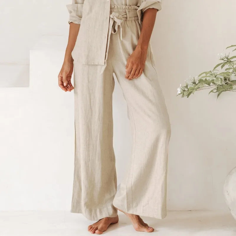 Light beige linen wide-leg trousers for women, loose pull-on style, with a relaxed fit and natural fabric appearance.